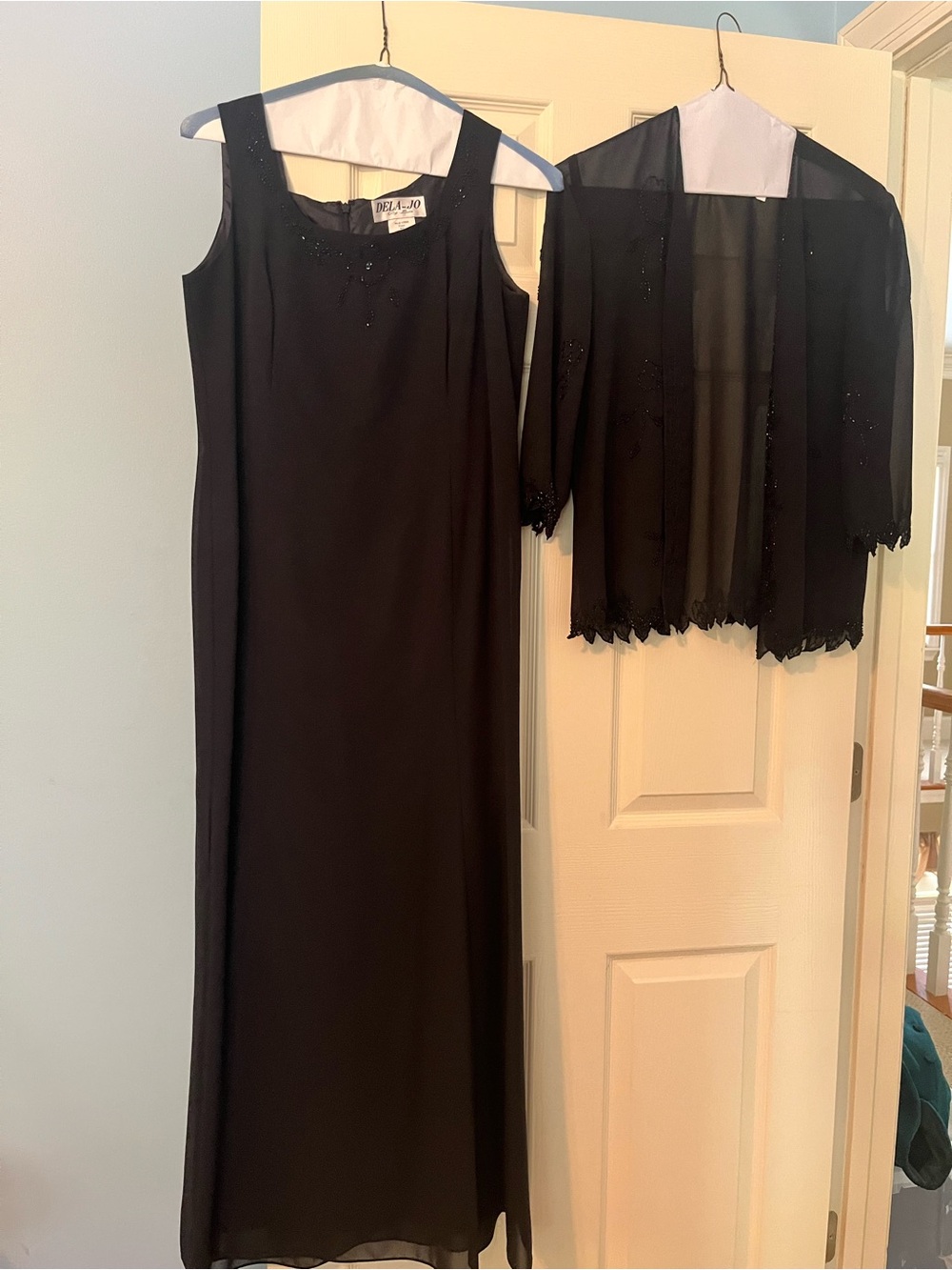 Elegant Black Sleeveless Evening Gown with Sheer Beaded Jacket